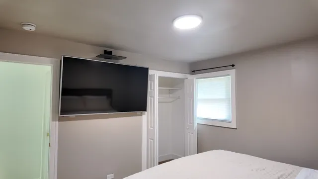 a bathroom with a shower and toilet