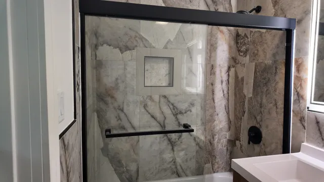 a view of a small space with wooden floor and a window