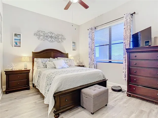 a bedroom with a bed and a dresser