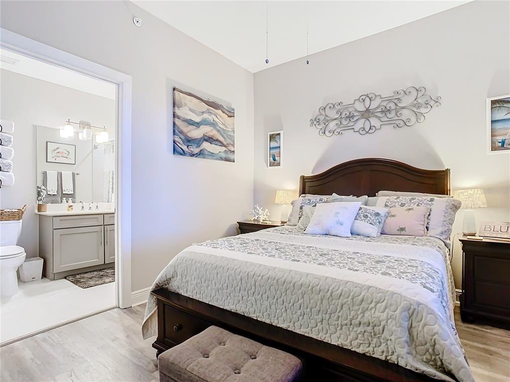 16300 County Road 455, Unit 610 Montverde, FL 34756 - Photo 14 of 22 a bedroom with a bed and a view of bathroom