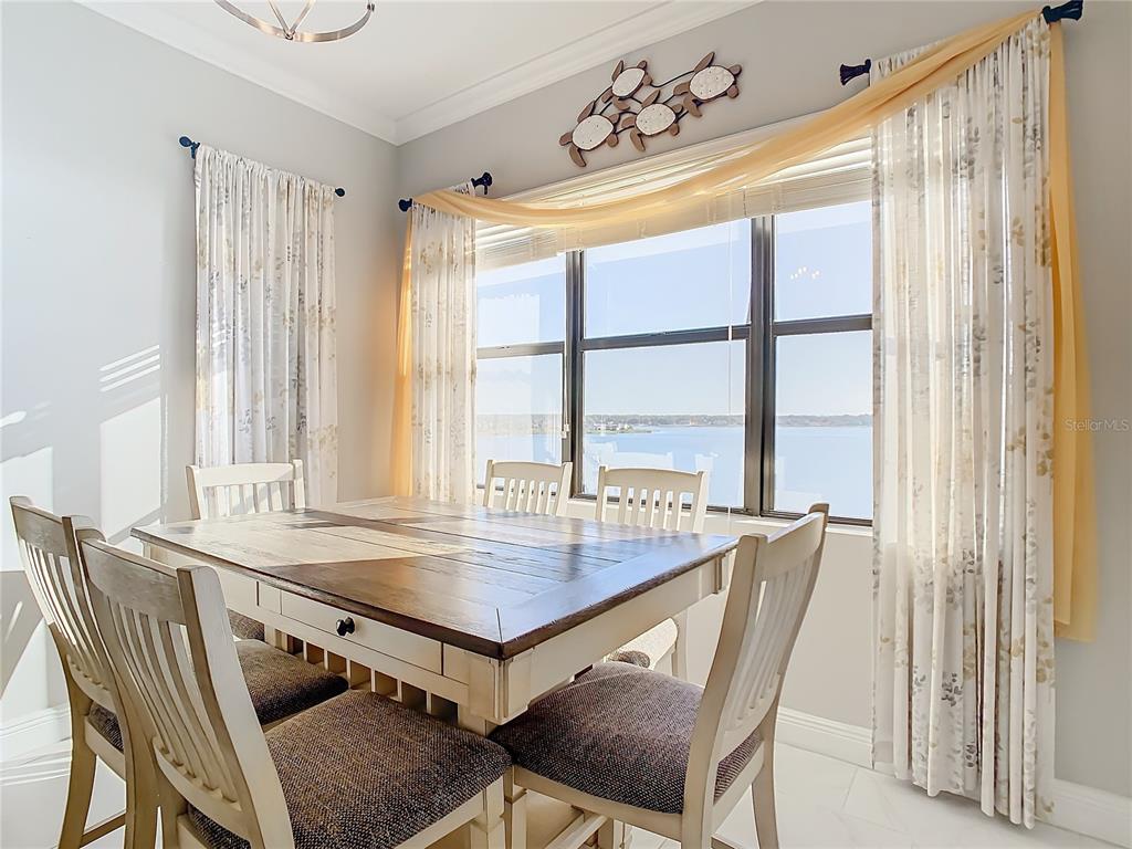 16300 County Road 455, Unit 610 Montverde, FL 34756 - Photo 7 of 22 a view of a dining room with furniture and a window