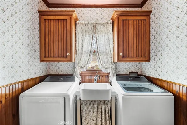 a kitchen with a stove a sink and a refrigerator