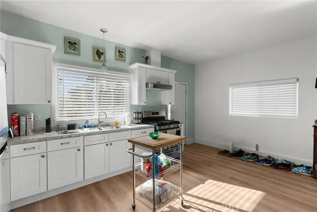 a view of a garden with furniture