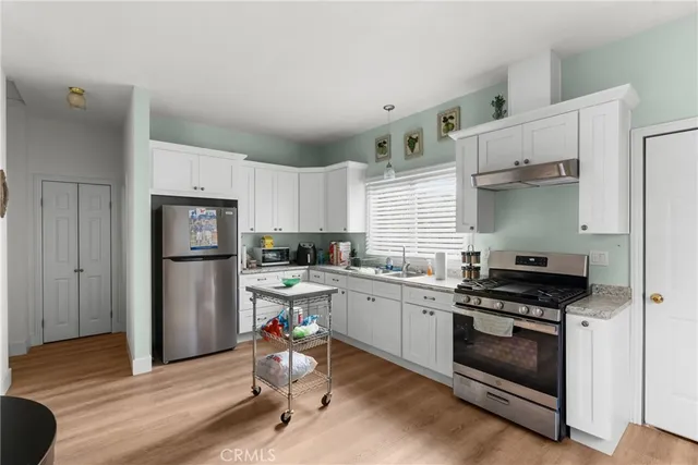 a view of a park with large trees