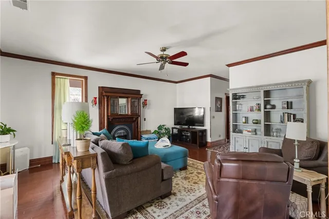 a living room with furniture fireplace and window