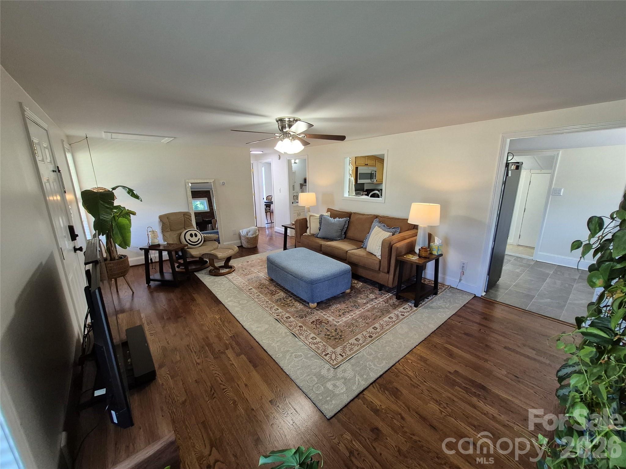 4438 Reepsville Road Vale, NC 28168 - Photo 15 of 32 a living room with furniture and a chandelier