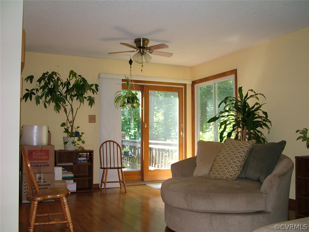 5721 Long Cove Road Midlothian, VA 23112 - Photo 22 of 42 a living room with furniture and a large window