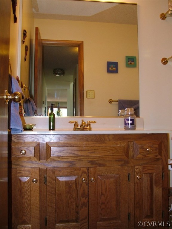 5721 Long Cove Road Midlothian, VA 23112 - Photo 24 of 42 a bathroom with a sink and a mirror