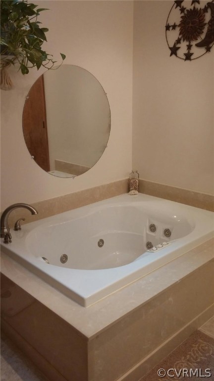 5721 Long Cove Road Midlothian, VA 23112 - Photo 31 of 42 a bathroom with a tub sink and mirror