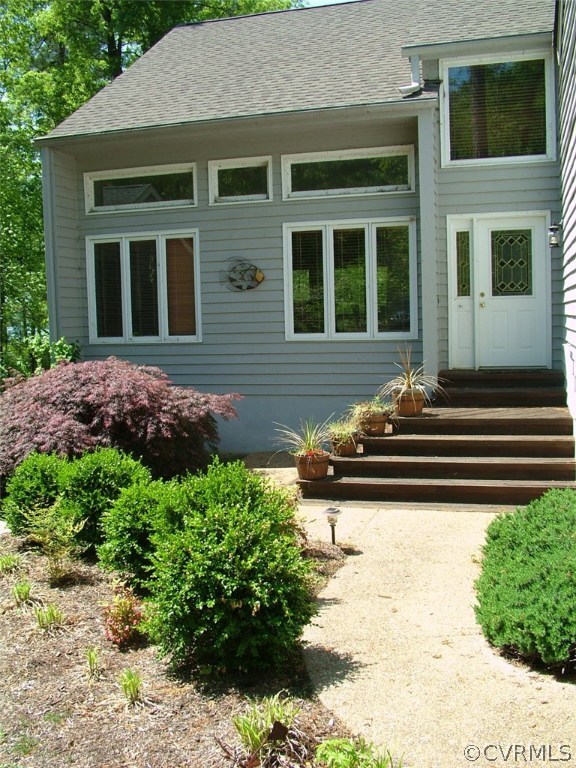 5721 Long Cove Road Midlothian, VA 23112 - Photo 5 of 42 a front view of a house with garden