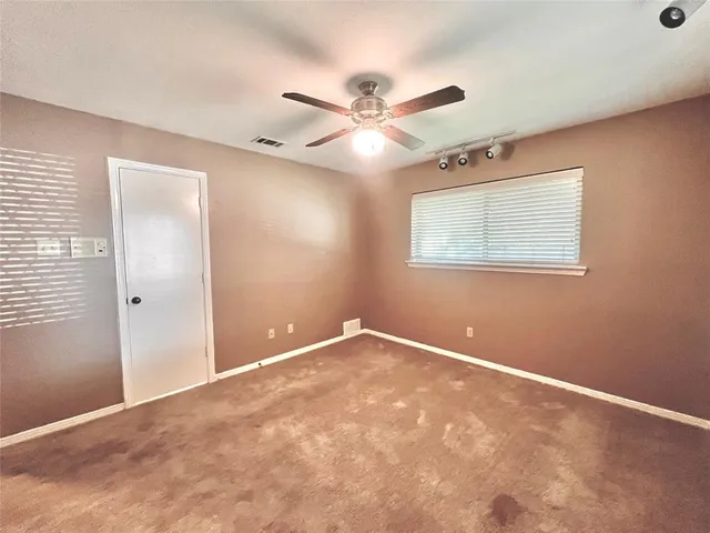 a bathroom with a granite countertop sink a mirror and vanity