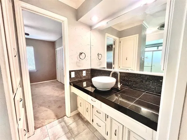 a white toilet sitting next to a shower