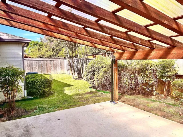 a view of a kitchen with wooden floor and cabinet