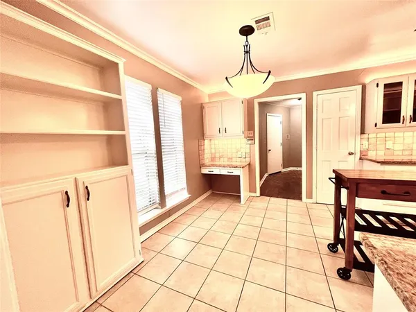 a view of a livingroom with furniture and hardwood floor
