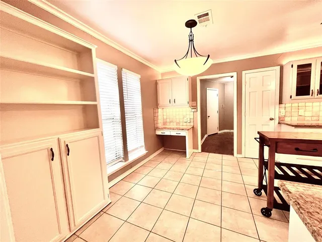 a view of a livingroom with furniture and hardwood floor