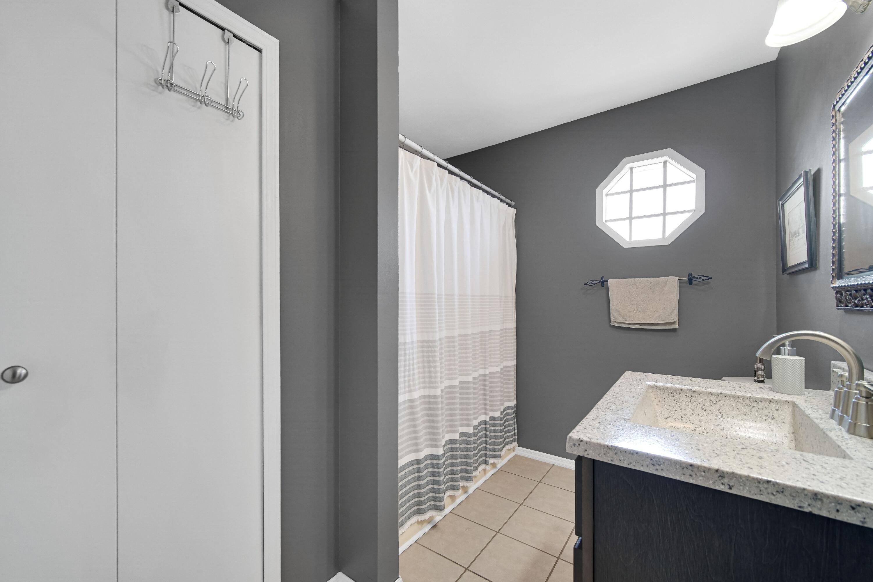 4000 Willowood Court Crown Point, IN 46307 - Photo 11 of 20 a bathroom with a sink and a mirror