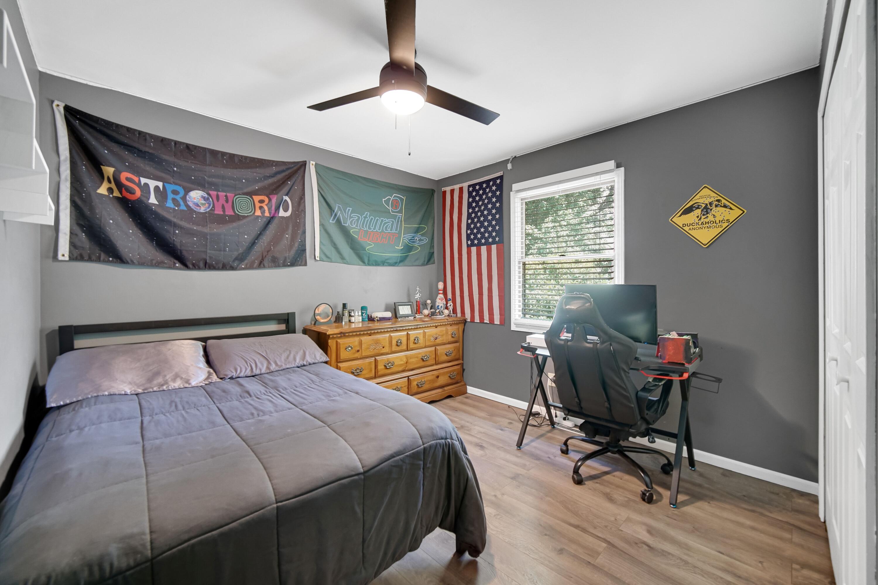 4000 Willowood Court Crown Point, IN 46307 - Photo 13 of 20 a bedroom with a bed and wooden floor