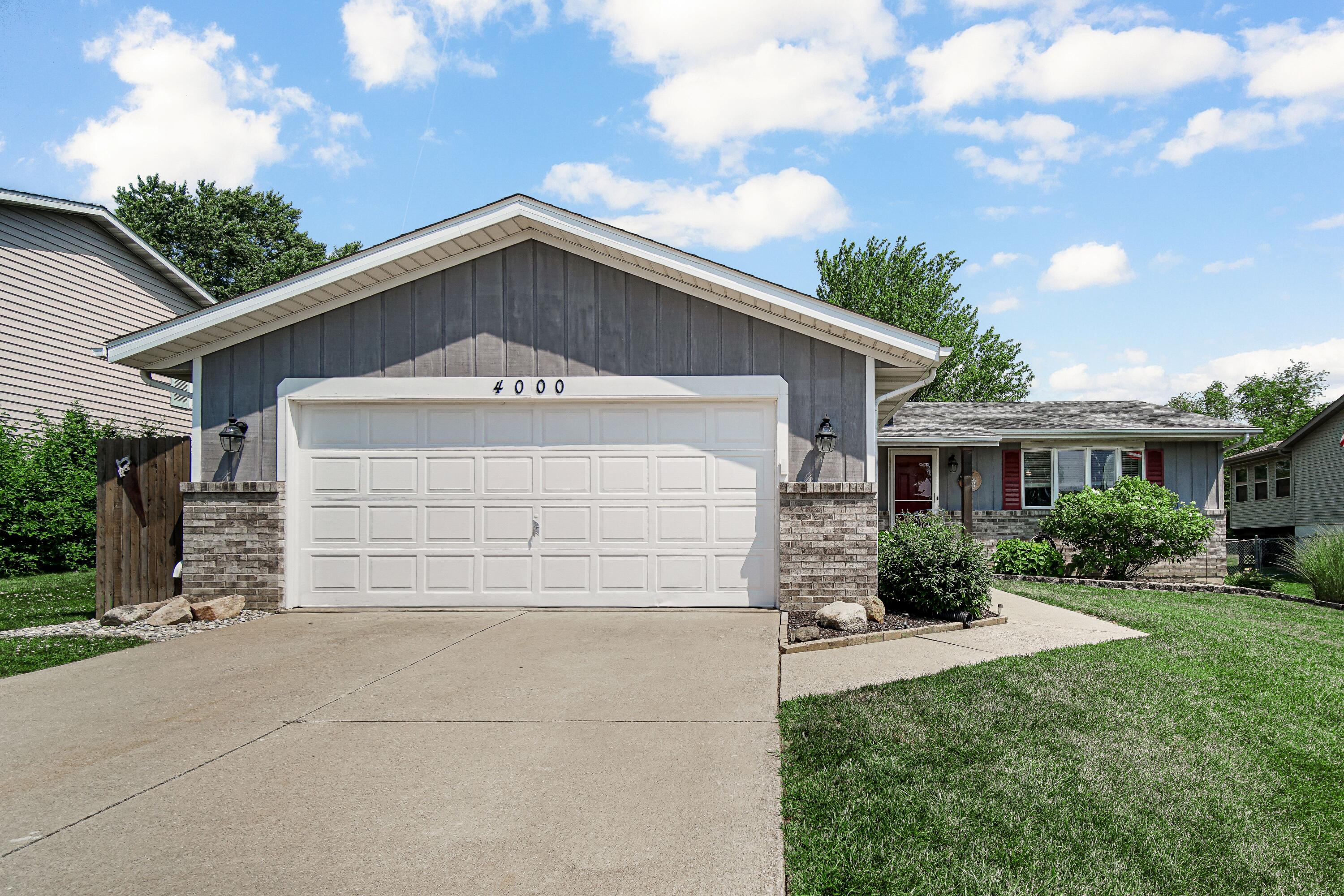 4000 Willowood Court Crown Point, IN 46307 - Photo 20 of 20 a front view of a house with a yard and garage