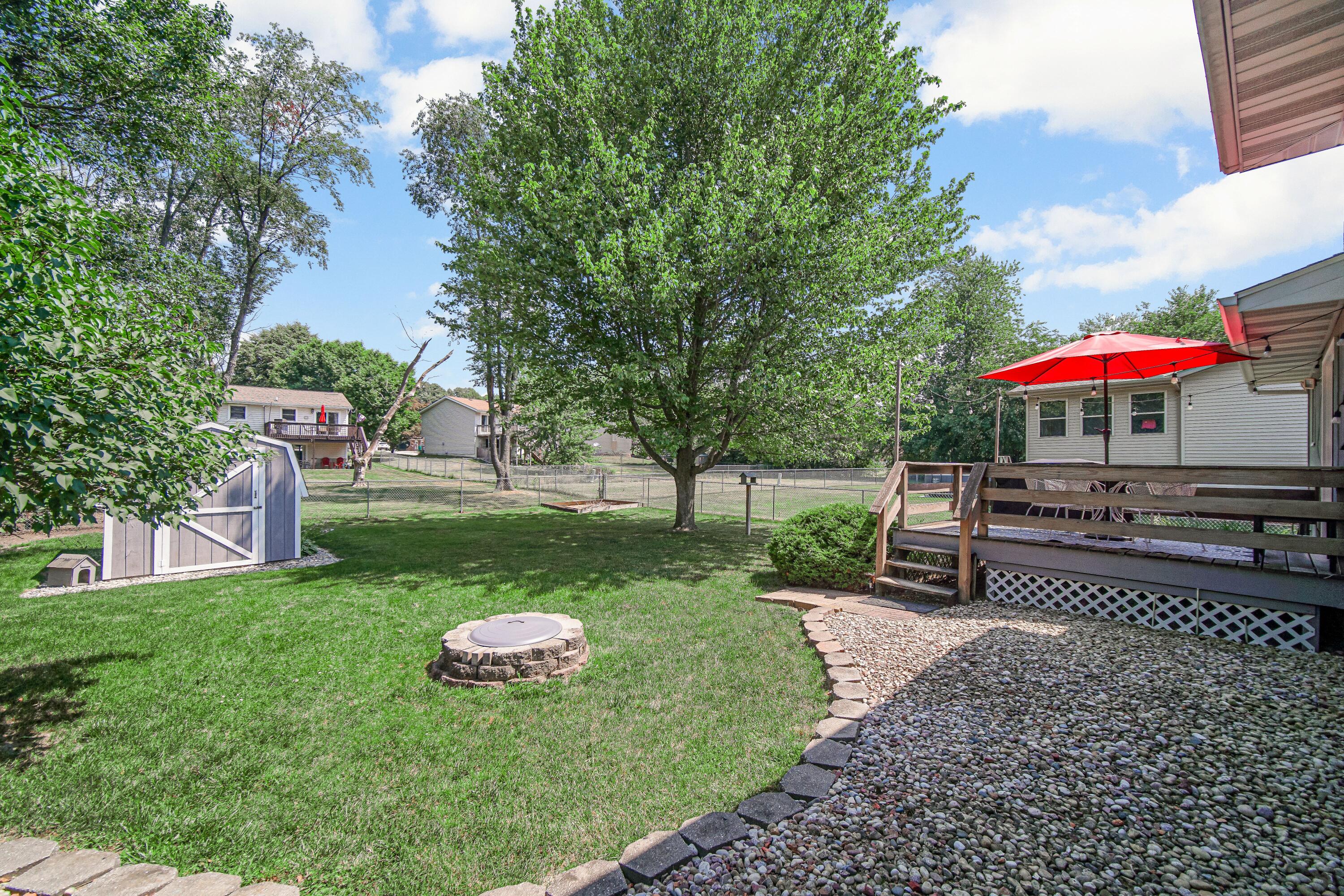 4000 Willowood Court Crown Point, IN 46307 - Photo 2 of 20 a view of a backyard with a patio