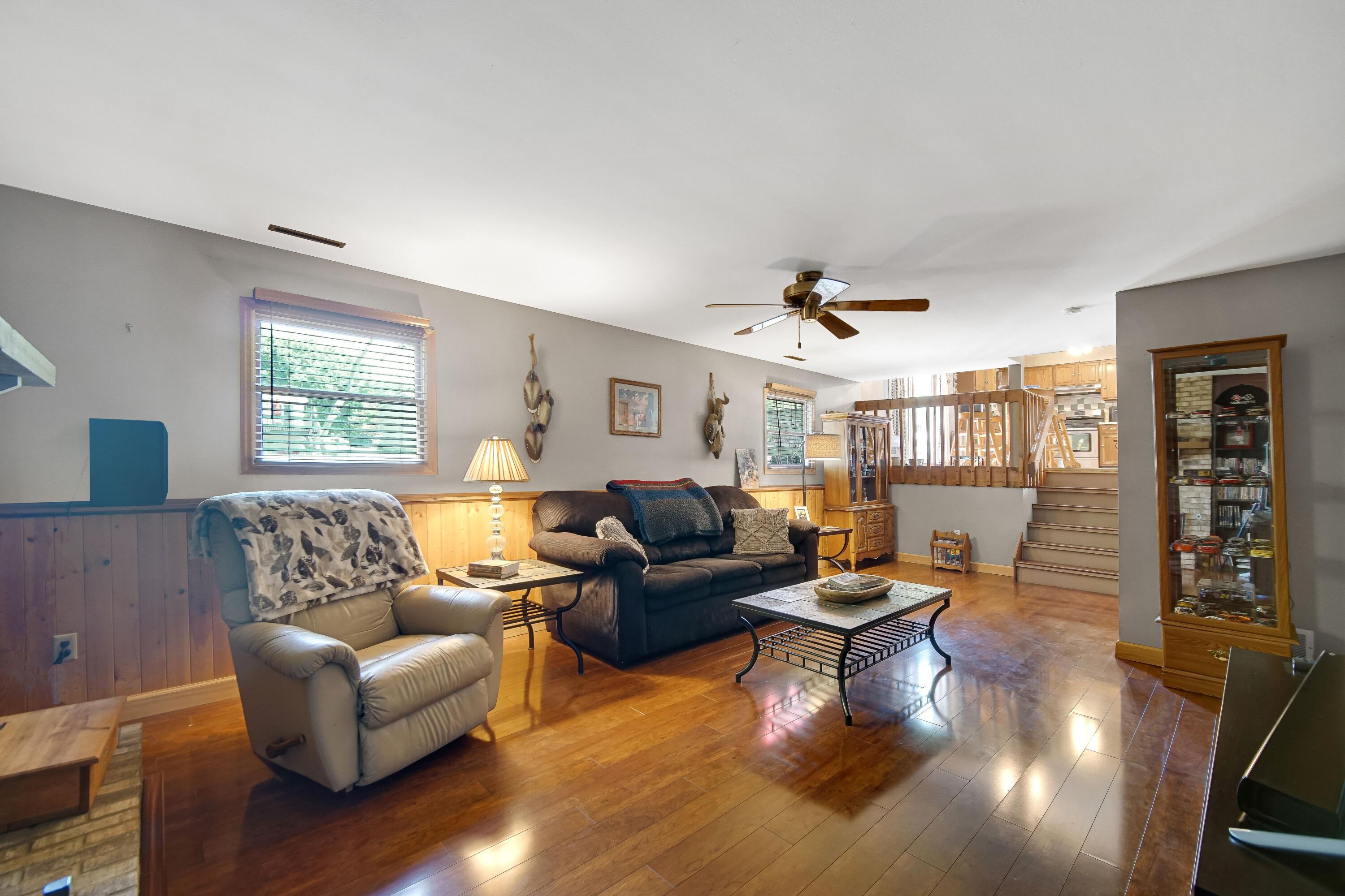 4000 Willowood Court Crown Point, IN 46307 - Photo 8 of 20 a living room with furniture and wooden floor