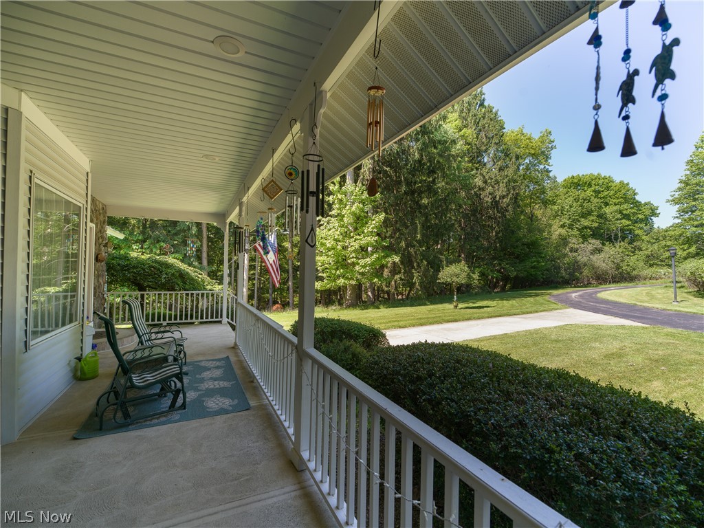 8745 Broadview Road Broadview Heights, OH 44147 - Photo 44 of 49 Spacious covered front porch with a concrete surface, white railing, and recessed lighting