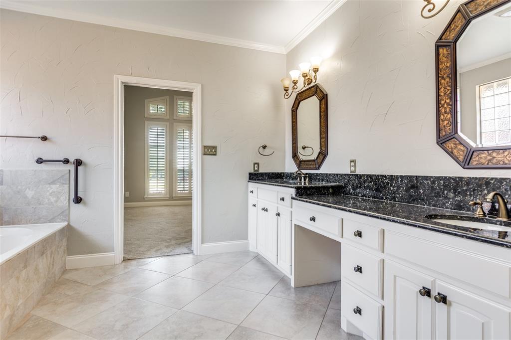 847 Turquoise Point Rockwall, TX 75032 - Photo 16 of 34 a bathroom with a sink and a mirror
