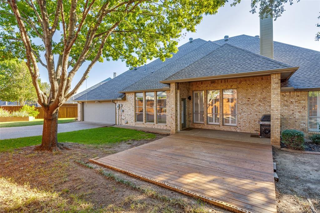 847 Turquoise Point Rockwall, TX 75032 - Photo 24 of 34 a front view of a house with a yard and trees