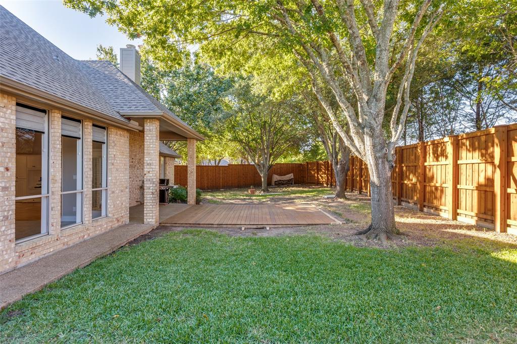 847 Turquoise Point Rockwall, TX 75032 - Photo 26 of 34 a view of a house with backyard and a tree