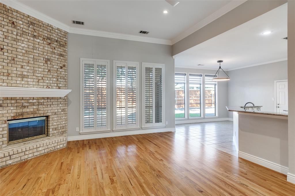 847 Turquoise Point Rockwall, TX 75032 - Photo 6 of 34 a view of an empty room with wooden floor and a window
