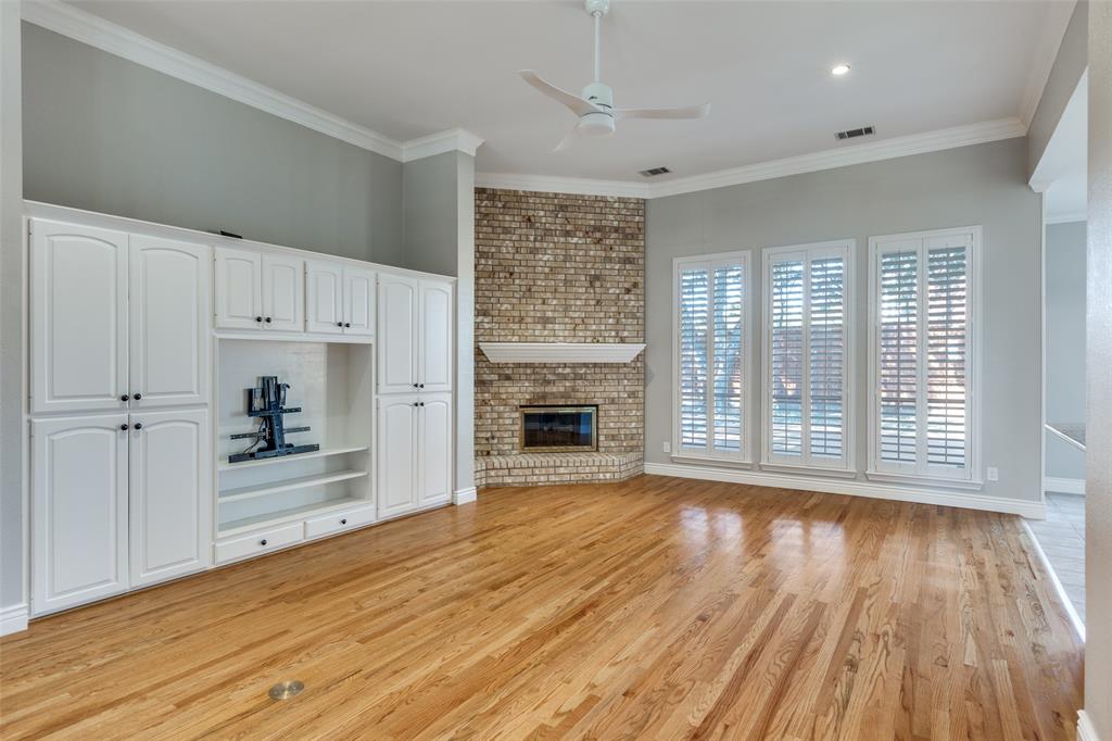 847 Turquoise Point Rockwall, TX 75032 - Photo 7 of 34 a view of an empty room with a window and wooden floor