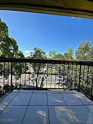 a view of outdoor space with wooden floor and fence