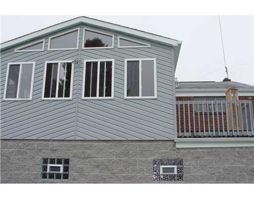 956 McCoy Road McKees Rocks, PA 15136 - Photo 16 of 18 Exterior Back. Outside looking at the Sunroom & D eck