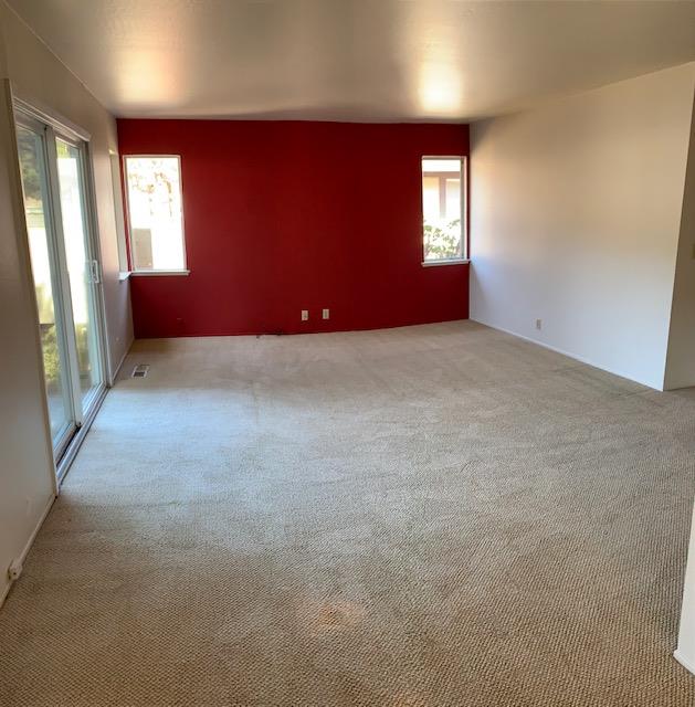 829 Rosita Road Pacifica, CA 94044 - Photo 2 of 14 an empty room with windows
