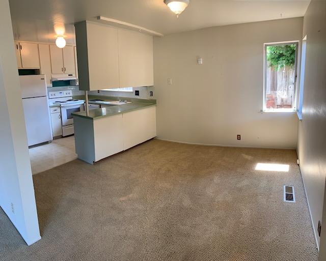 829 Rosita Road Pacifica, CA 94044 - Photo 6 of 14 a kitchen with stainless steel appliances granite countertop a sink and a stove