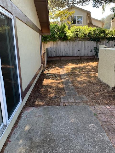 829 Rosita Road Pacifica, CA 94044 - Photo 10 of 14 a view of a backyard with wooden fence