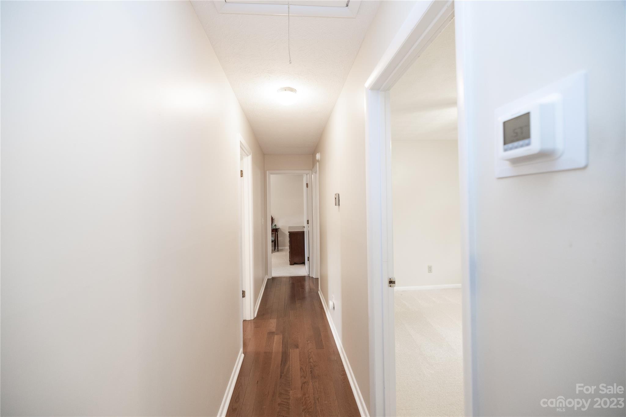 19 Norman Road Fletcher, NC 28732 - Photo 13 of 30 a view of a hallway with wooden floor