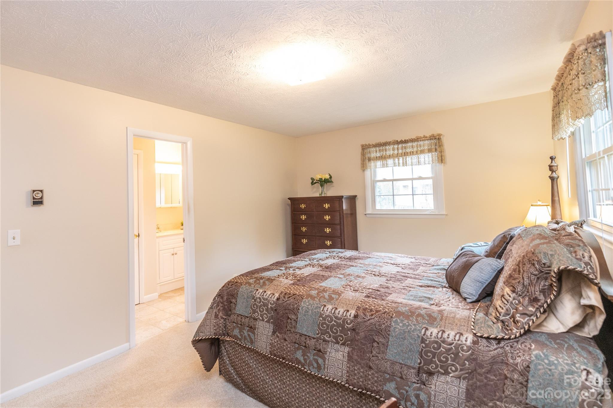 19 Norman Road Fletcher, NC 28732 - Photo 15 of 30 a bedroom with a bed and a window