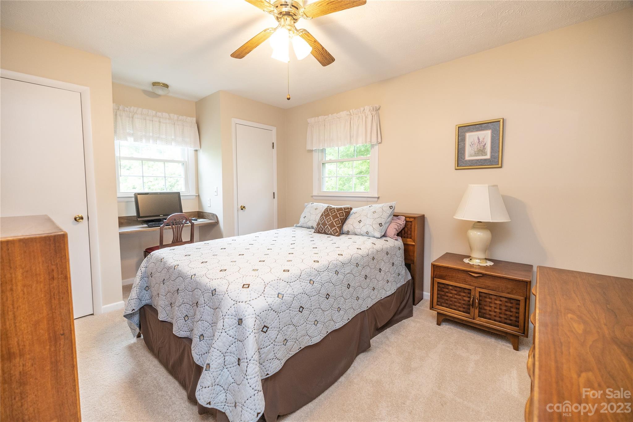 19 Norman Road Fletcher, NC 28732 - Photo 18 of 30 a bedroom with a bed and a chandelier