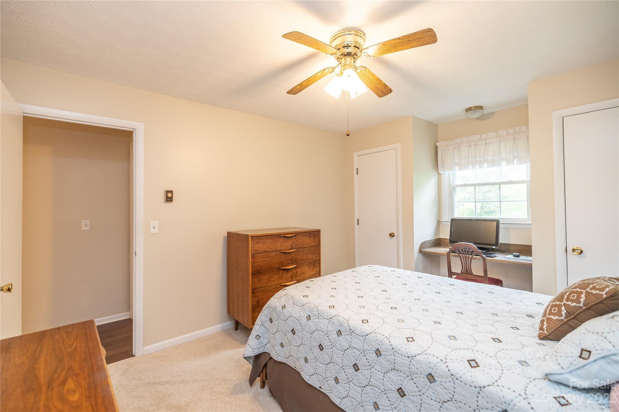 19 Norman Road Fletcher, NC 28732 - Photo 19 of 30 a bedroom with a bed and a dresser