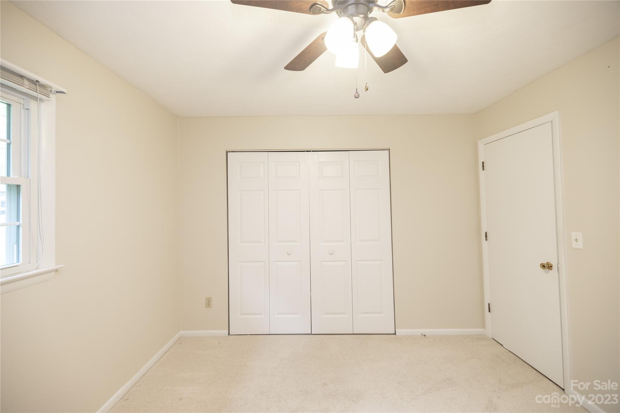 19 Norman Road Fletcher, NC 28732 - Photo 21 of 30 an empty room with chandelier fan