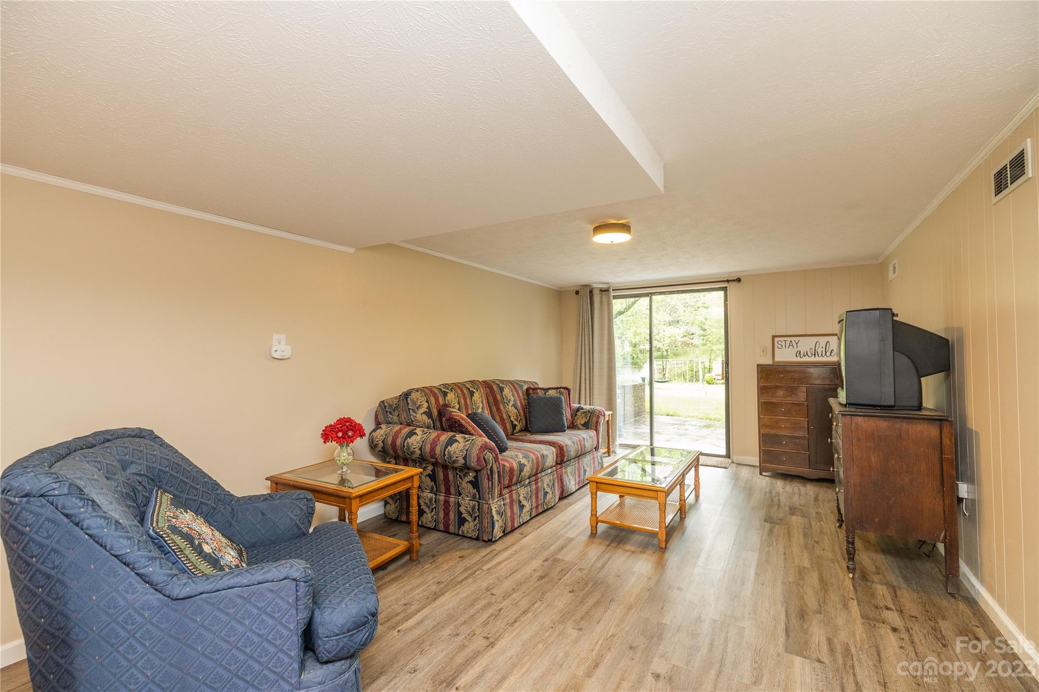 19 Norman Road Fletcher, NC 28732 - Photo 25 of 30 a living room with furniture and a flat screen tv