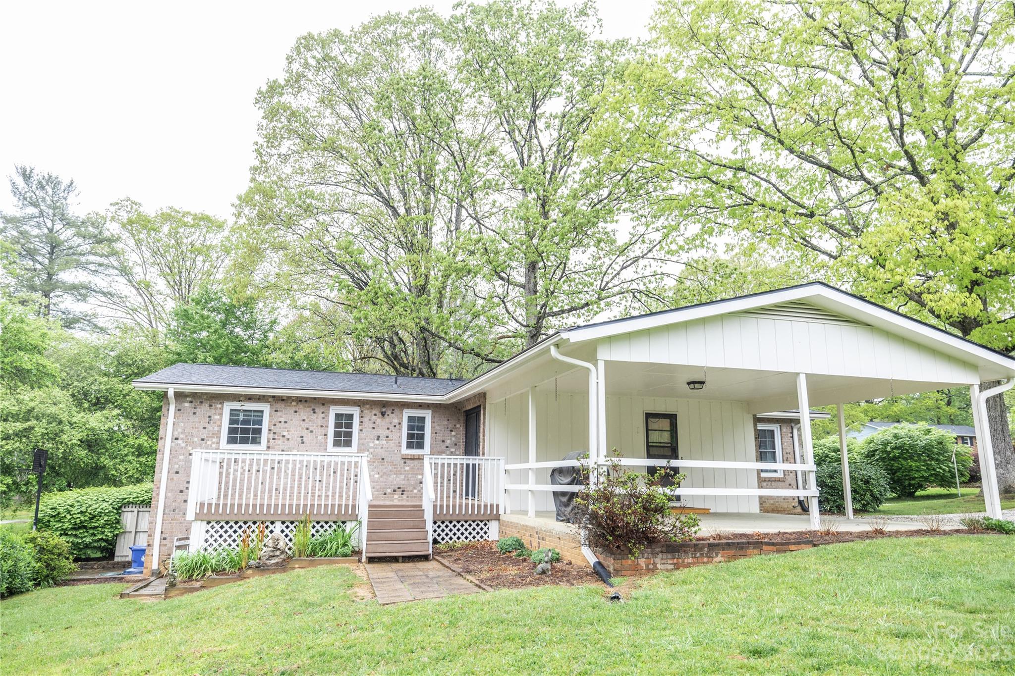 19 Norman Road Fletcher, NC 28732 - Photo 29 of 30 a view of a house with a yard and sitting area