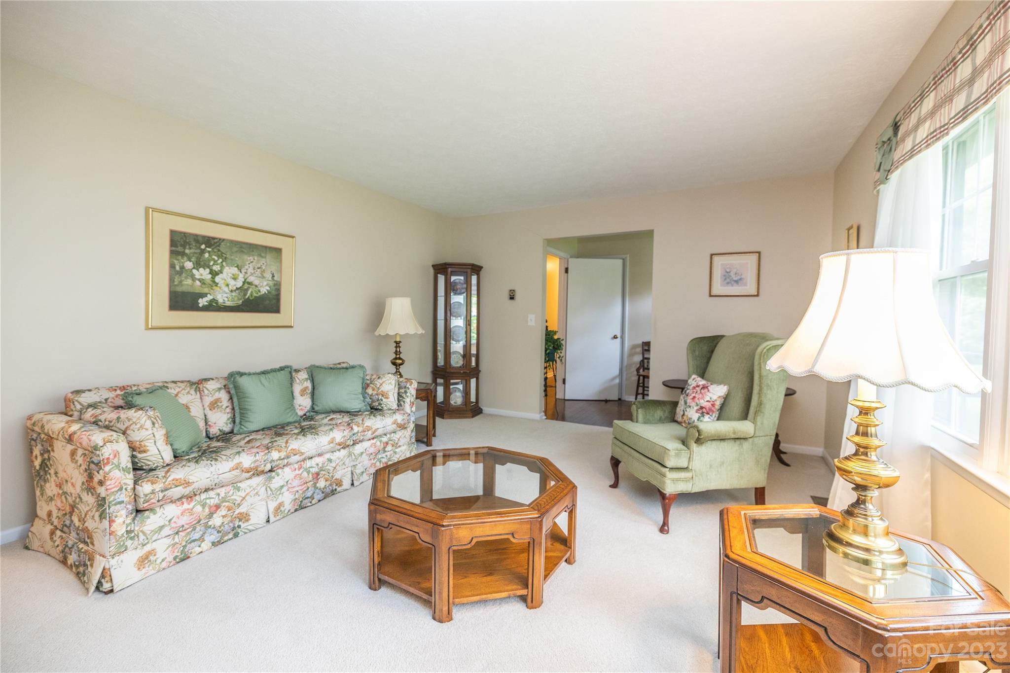 19 Norman Road Fletcher, NC 28732 - Photo 5 of 30 a living room with furniture and a flat screen tv