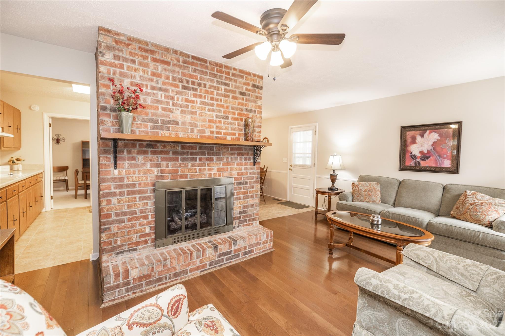 19 Norman Road Fletcher, NC 28732 - Photo 7 of 30 a living room with furniture and a fireplace