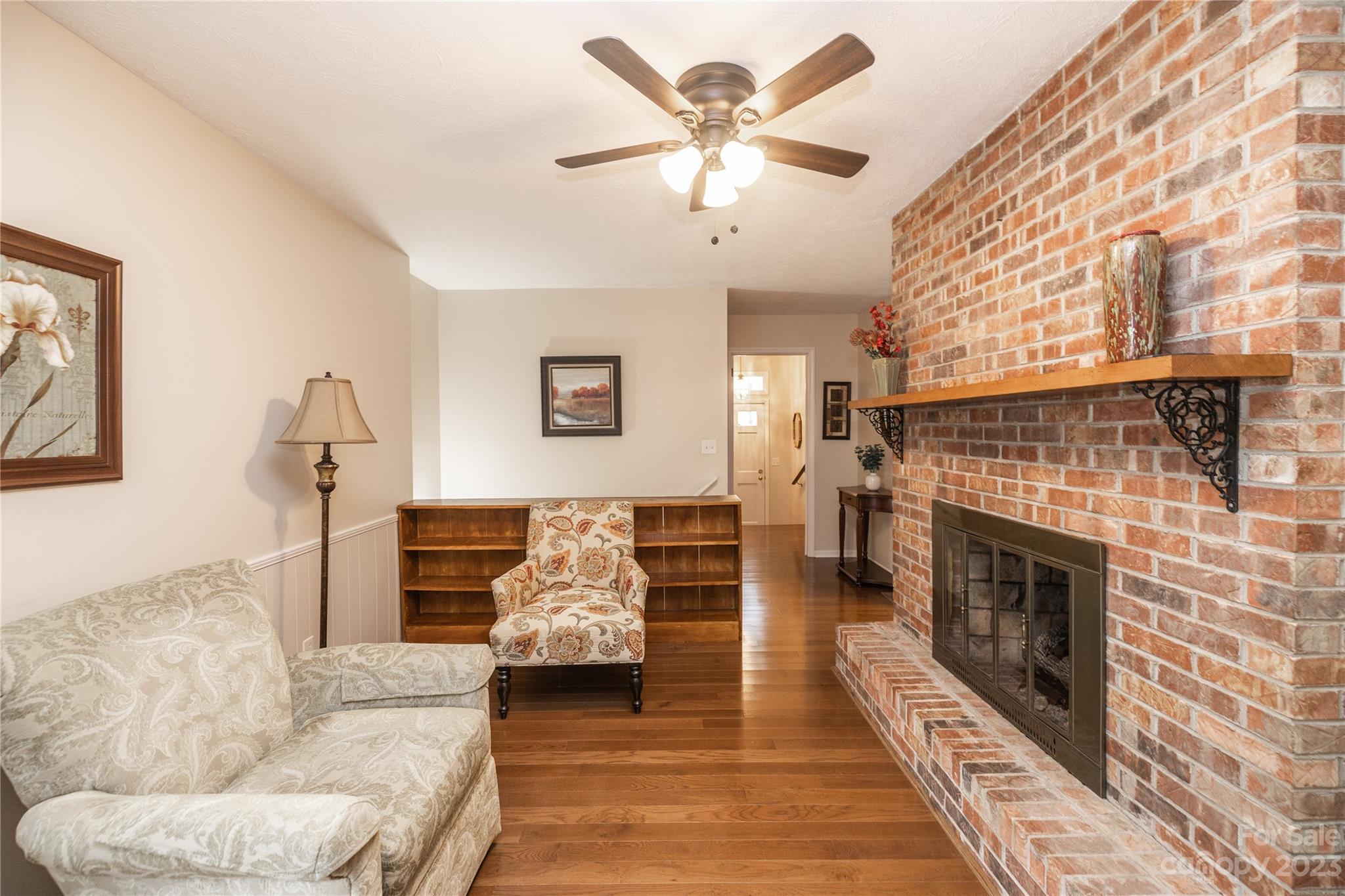 19 Norman Road Fletcher, NC 28732 - Photo 8 of 30 a living room with furniture and a fireplace