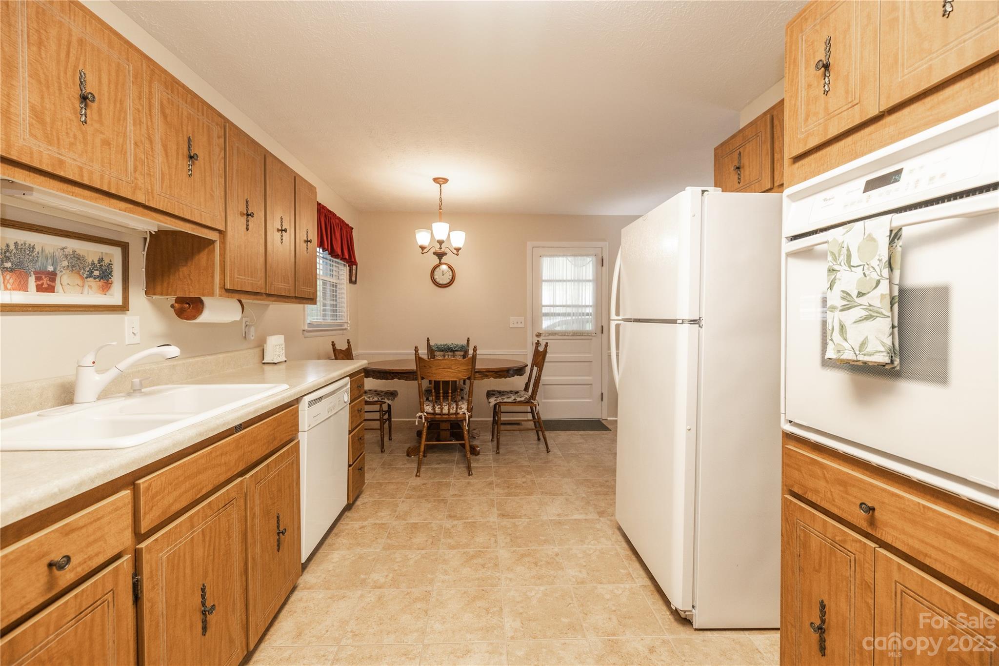 19 Norman Road Fletcher, NC 28732 - Photo 10 of 30 a kitchen with sink cabinets and window