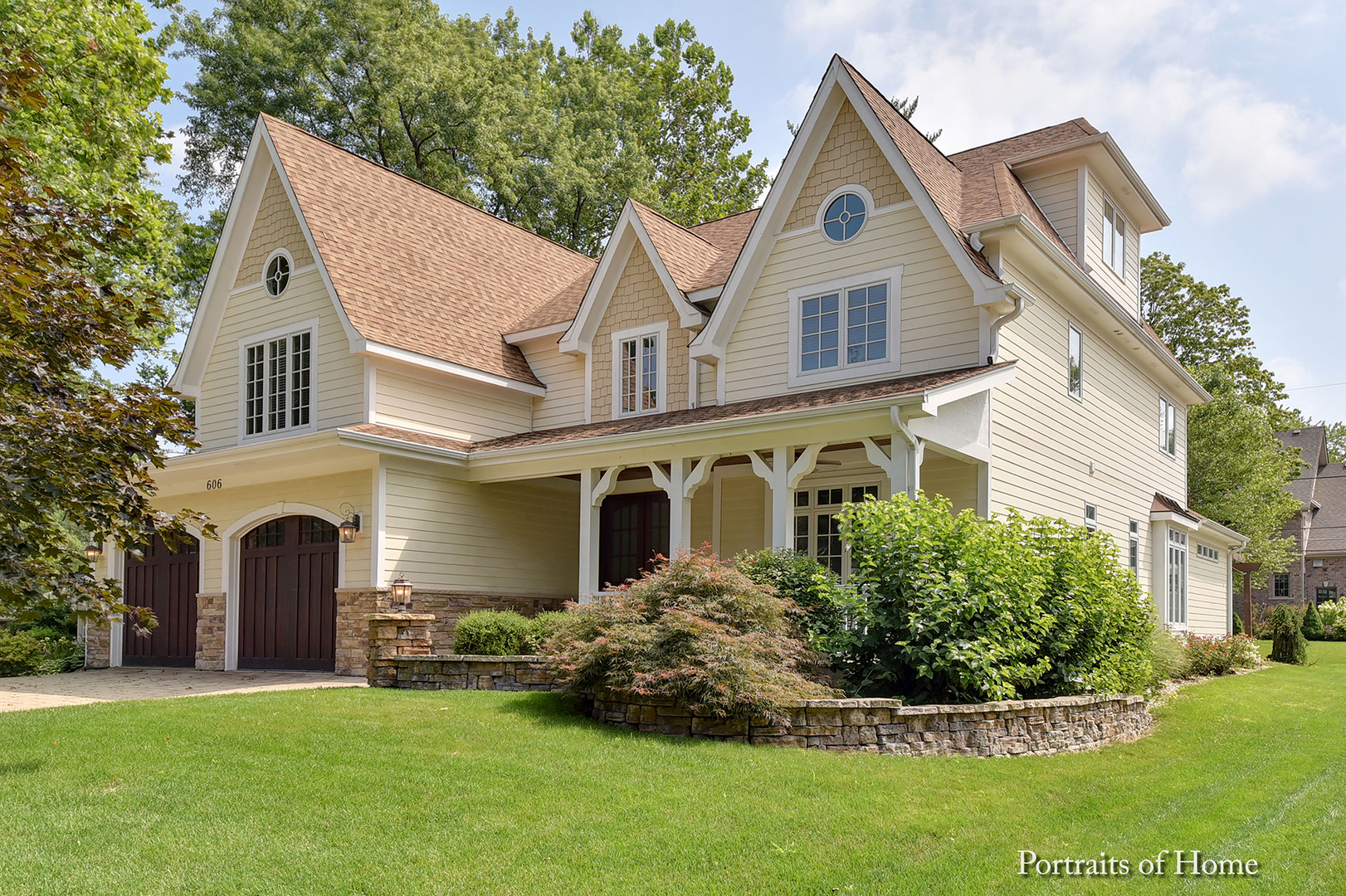 606 Wellner Road Naperville, IL 60540 - Photo 2 of 30 a front view of a house with a garden