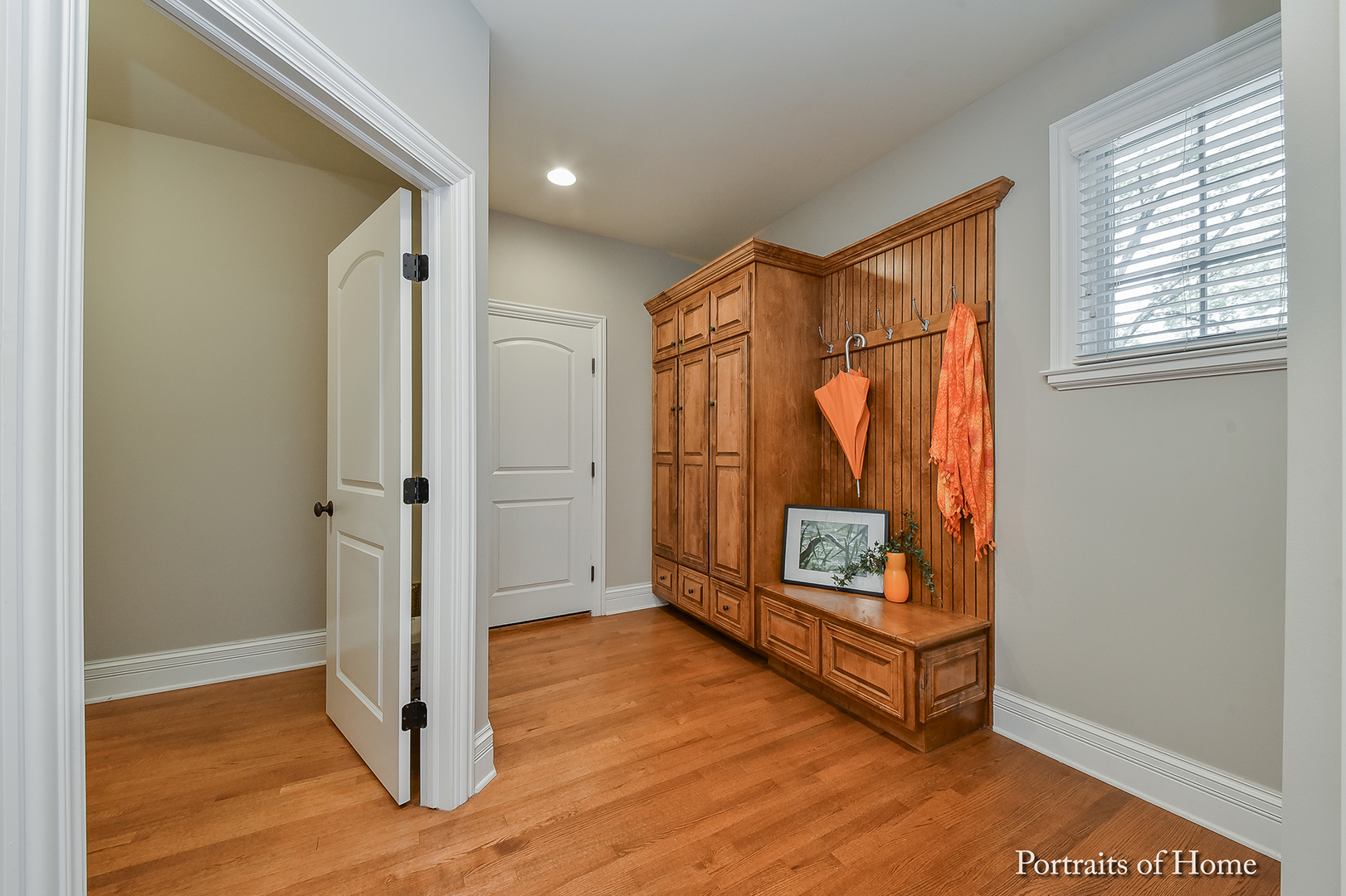 606 Wellner Road Naperville, IL 60540 - Photo 16 of 30 a view of an empty room with wooden floor and a window