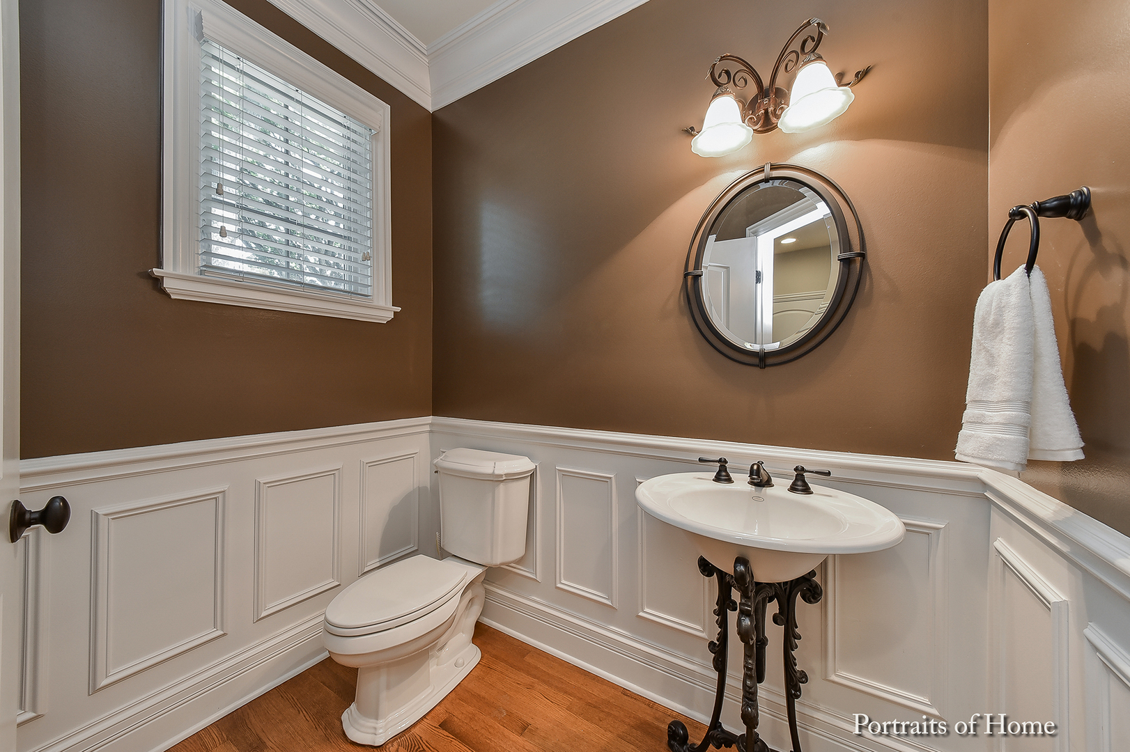 606 Wellner Road Naperville, IL 60540 - Photo 17 of 30 a bathroom with a toilet a sink and mirror