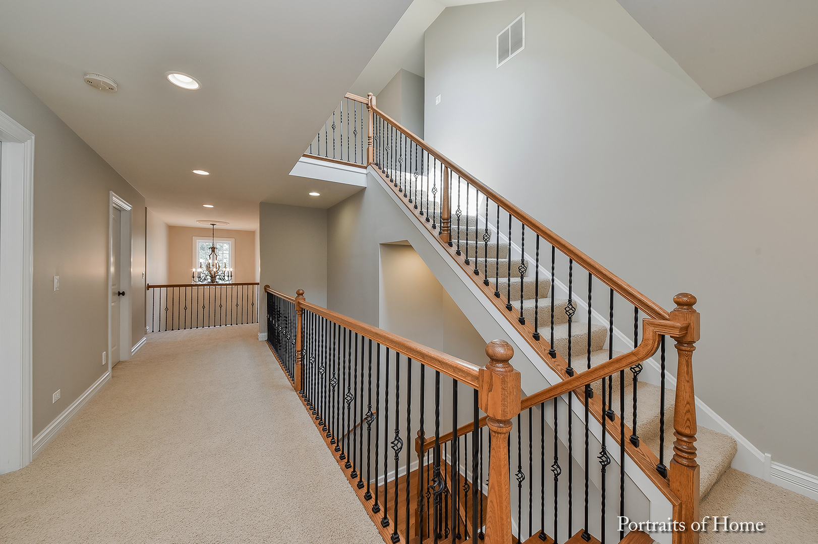 606 Wellner Road Naperville, IL 60540 - Photo 18 of 30 a view of a hallway with wooden floor and stairs